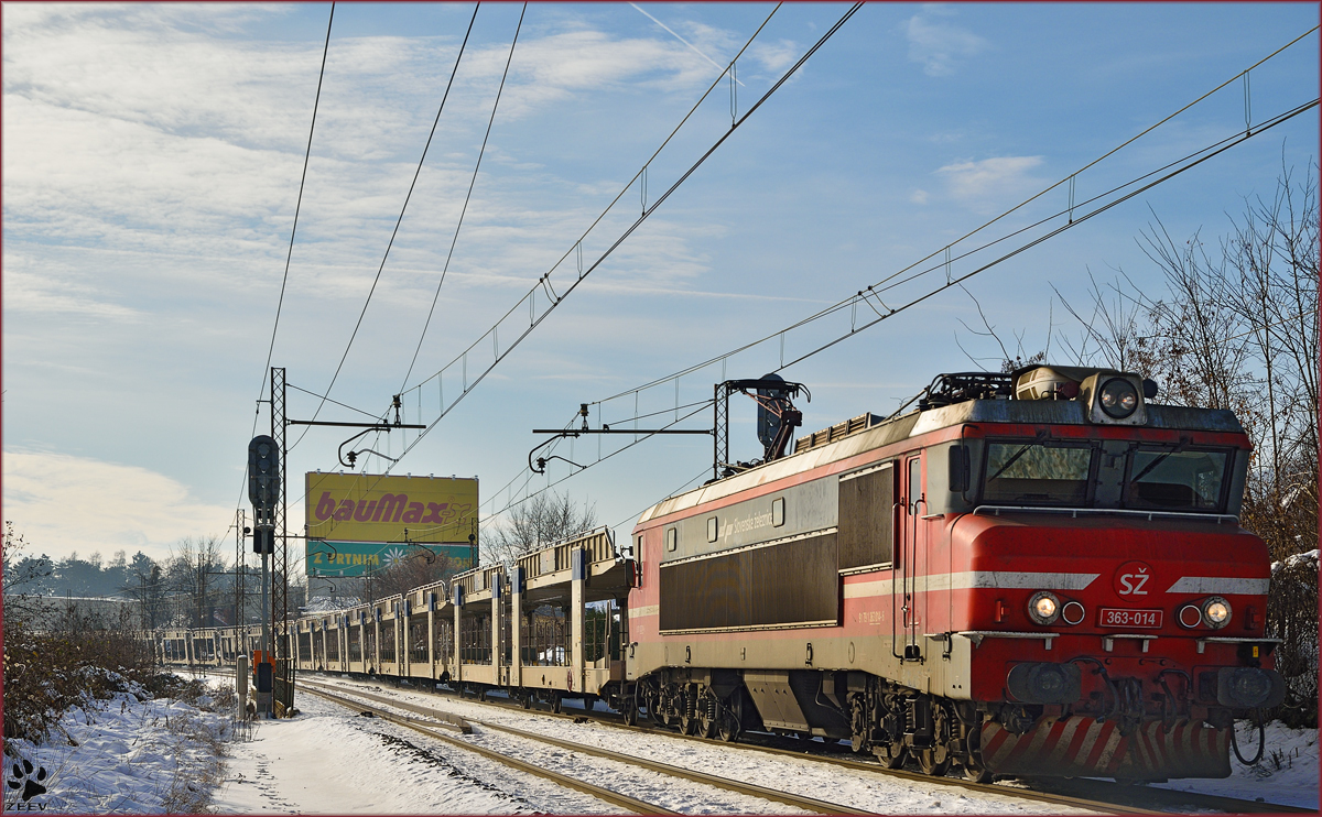 Electric loc 363-014 pull freight train through Maribor-Tabor on the way to the north. /2.1.2015