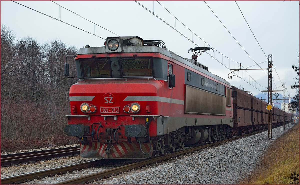 Electric loc 363-015 is hauling freight train through Maribor-Tabor on the way to Koper port. /20.1.2014
