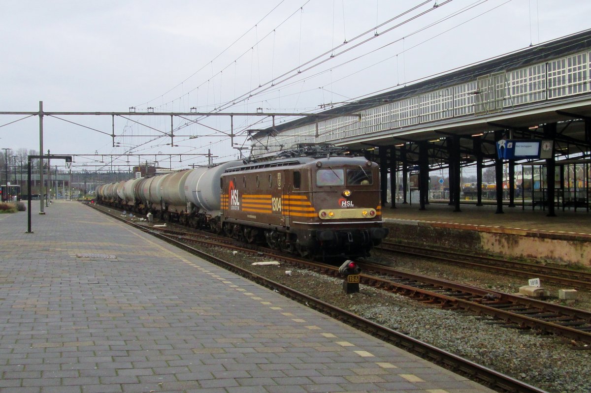 HSL 1304 hauls a tank train through Amersfoort on 9 January 2016.