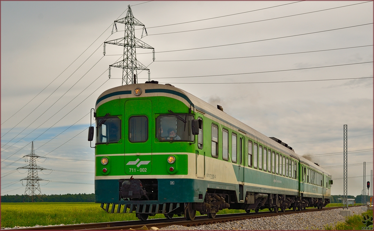 Multiple units 711-002 are running through Cirkovce on the way to Maribor. /9.5.2014 