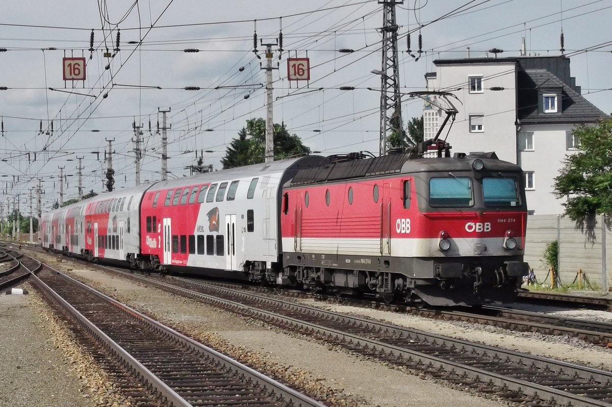 ÖBB 1144 274 pushes a regional express out of Wiener Neustadt on 31 May 2015.