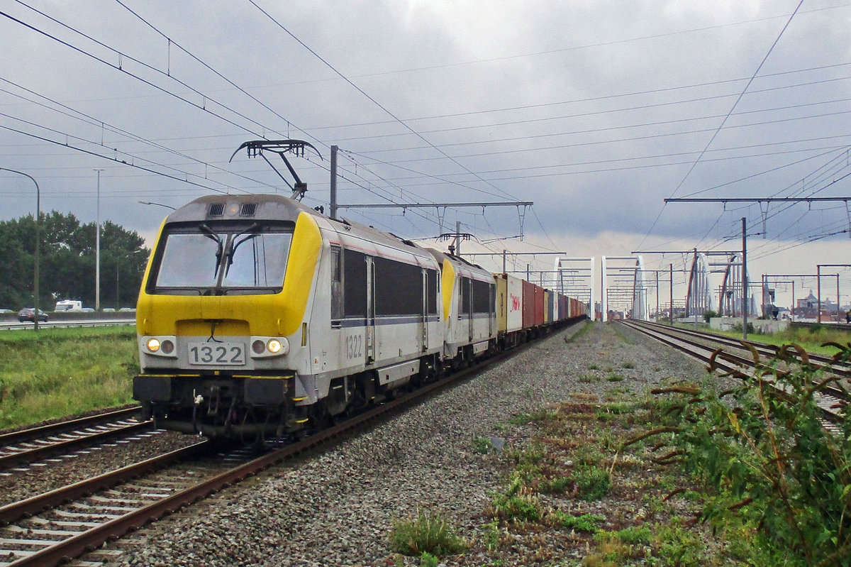 On a grey 18 June 2014 NMBS 1322 hauls a container train through Antwerpen-Luchtbal.