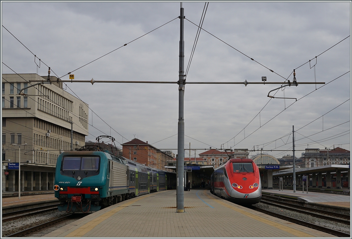 The FS trenitalia E 464 621 is leaving Torino PN and a ETR 500 Frecciarossa is waiting his departure time to Roma.
10.03.2016