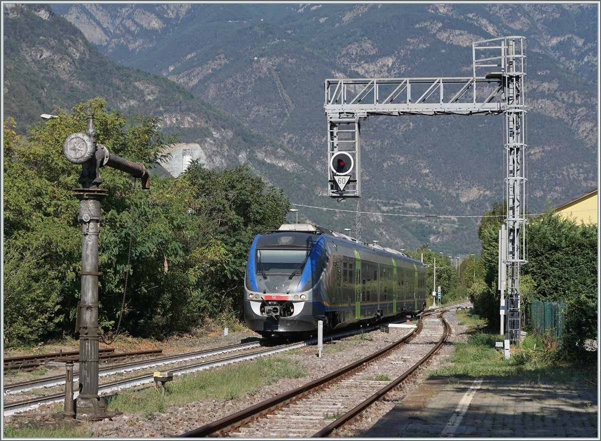 The FS Trenitalia MD 502 056 (95 83 4502 056-3) on the journey from Aosta to Ivrea is arriving at the Verres station 

Sept. 11, 2023