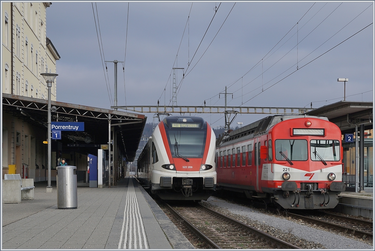 The SBB RABe 522 209 from Delle to Biel/Bierne and the BLS CJ RBDe 566 221 to Bonfol in the Porrentury Station.15.12.2018