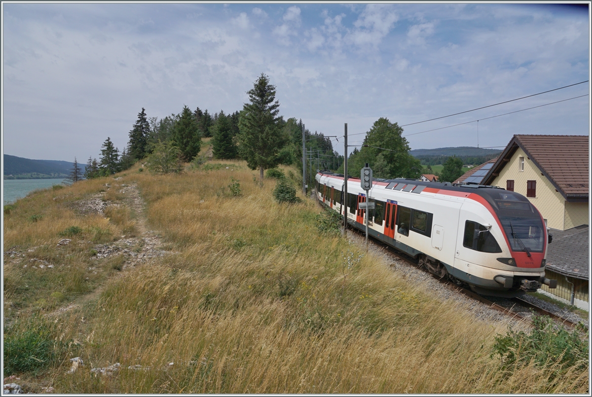 The SBB RABe 523 018 is on the way from Le Brasuss to Aigle as S 4 be Le Pont. On the left of the picture you can see a small corner of Lac de Joux. As a result, the train travels along the Lac de Brenet and later Lake Geneva - as a result, we now also have a  three lake railway .
July 23, 2023