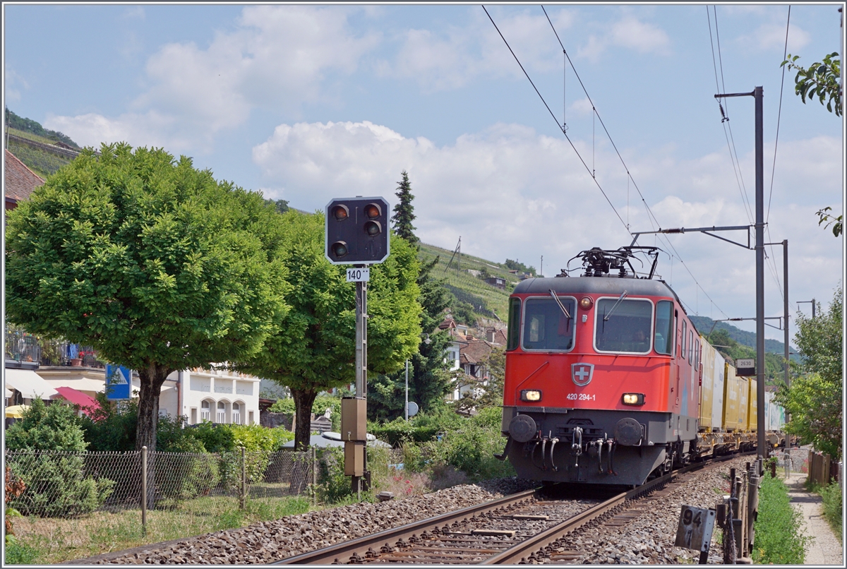 The SBB Re 4/4 II 11294 (Re 420 294-1)  Zirkus Knie  with a Cargo train by Ligerz. 

05.06.2023