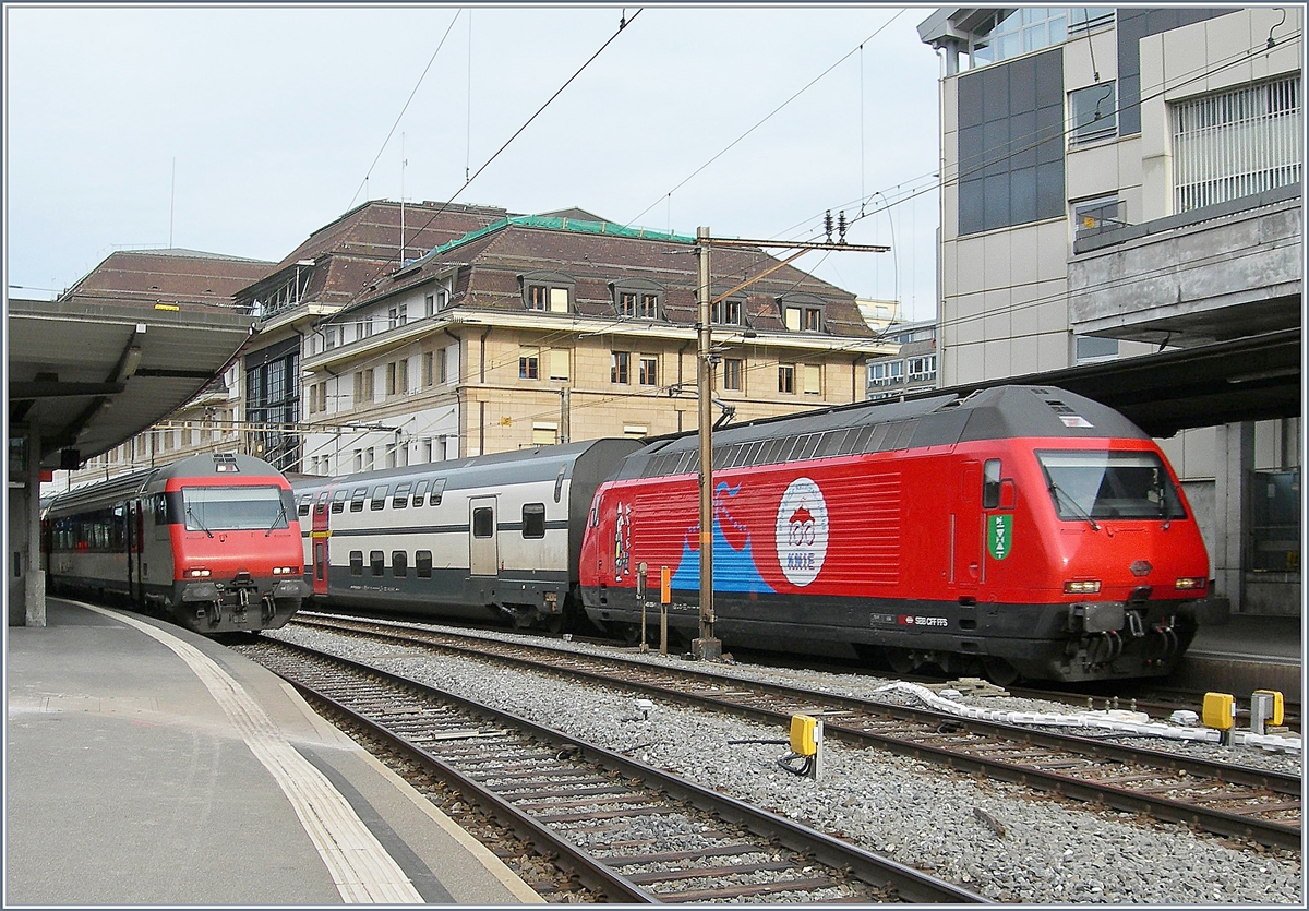 The SBB Re 460 058-1  100 years Circus Knie  with his IC1 713 in Lausanne.

21.04.2019