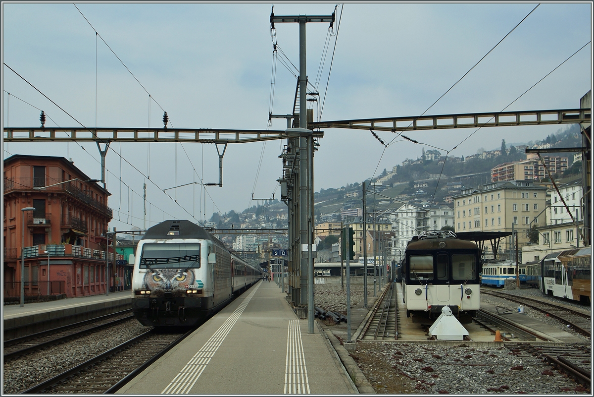 The SBB Re 460 105-0 and the MOB Be 4/4 1007 in Montreux.