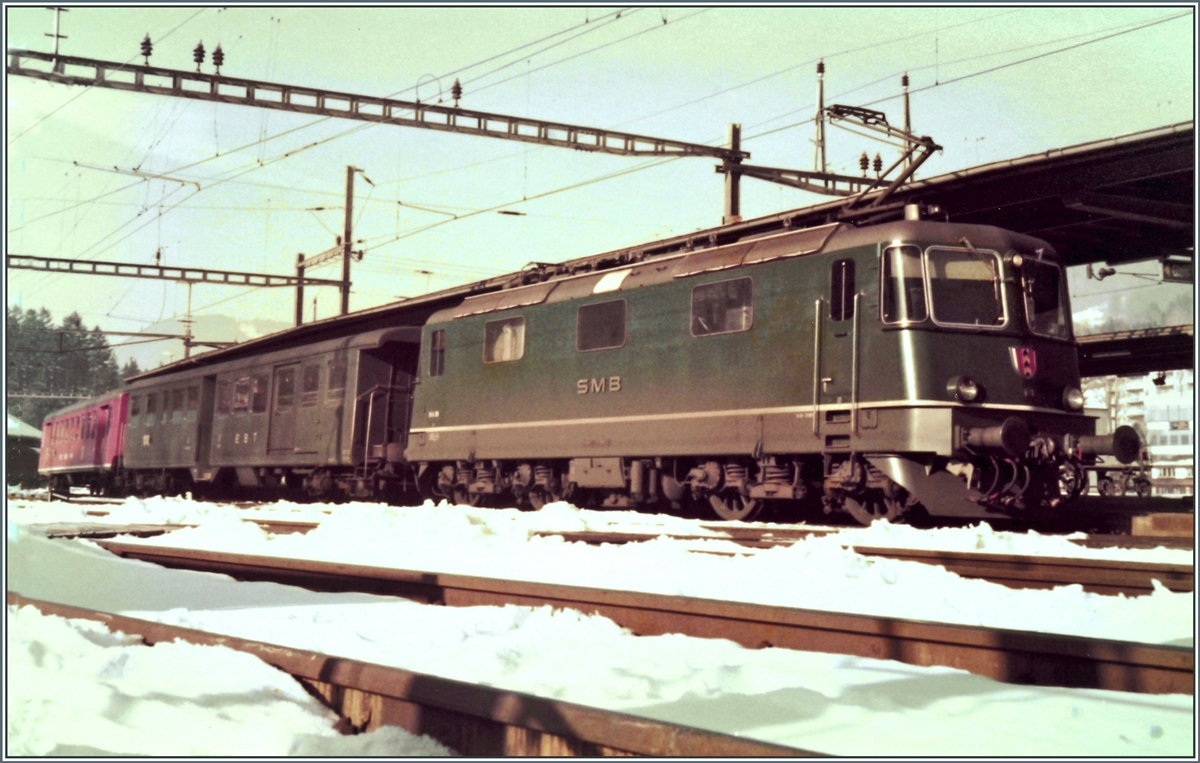The SMB Re 4/4 III 181 wiht a local train to Solothurn in Moutier. 

Analog picture from the 23.02.1985