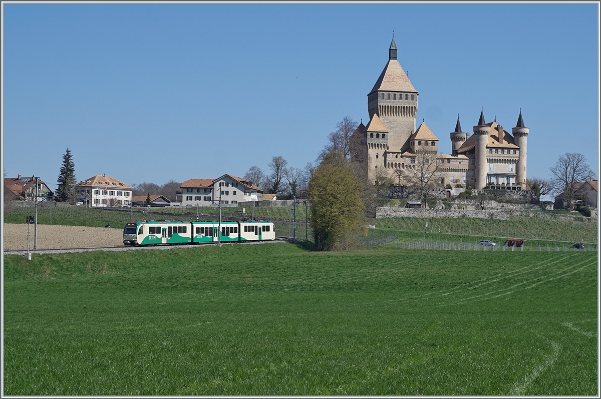 Two BAM MBC SURF Be 4/4 with their middle car are on the way from Morges as regional train 125 in front of Vufflens le Château. In the background and not to be overlooked is the castle of Vufflens. 

April 5, 2023