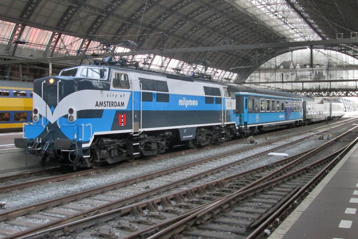With a Dinner Train, RailPromo 1215 prepares to quit Amsterdam Centraal on 16 April 2016.