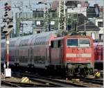 111 111 093-1 is pushing its train out of the main station of Cologne on September 19th, 2011.