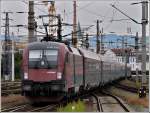 1116 1116 214 is pushing a railjet unit out of the station of Linz on September 14th, 2010.