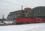 143 DB 143 254-1 on 10.1.2010 at Berlin-Ostbahnhof. The snowplow has many to do.