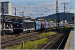 CFL Cargo 185 574-1 is hauling a goods train through ...