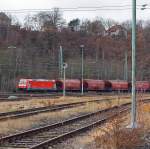 185 185 402-5 (TRAXX F140 AC2) of DB Schenker Rail Danmark Services A / S - Denmark (A joint venture of DB Schenker Rail Cargo and Green) with grain silo wagons Tagnoos 898 complete train, runs on 10.12.2011 by Betzdorf/Sieg in the direction Siegen.