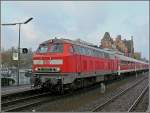 218 137-8 is leaving the station of Gerolstein on its ...