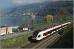 523 The REV S1 to Yverdon is just leaving Villeneuve Station. 
29.03.2011
