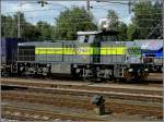 6400-6500 ACTS 7104 is hauling a goods train through the station of Roosendaal on September 5th, 2009. 
