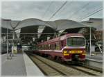 AM 86 931 is leaving the station of Louvain on ...