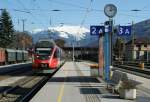 BB S-Bahn service to Telfs Pfaffenhofen is arriving on the Hall im Tirol Station.