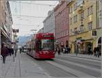 Tram 308 is running through the Museumsstrae at Innsbruck on December 22nd, 2009.