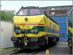The diesel locomotive 5506 pictured in front of the depot Kinkempois on May 18th, 2008. These engines were provided in operation by the SNCB in the years 1961-1962, they particularly run in the south of Belgium. The point before the number means that this locomotive has a heater. On the red stripes and the words TVM can be seen, that this engine can reach a speed of 200 km/h and is allowed to ride on the high speed line between Lige and Louvain to tow wrecked high speed trains. Various locomotives of this series also have the words L2, then they can go up to St Louis (France). 