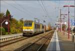 SNCB HLE 1304 and 1305 are hauling a freight train through the station of Ptange on September 23rd, 2012.
