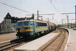 On 16 May 2002, tank train with NMBS 2149 passes slowly through the since 2013 defunct station Antwerpen-Dam.