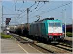 . The TRAXX HLE 2822 is hauling a goods train through the station Antwerpen Nooderdokken on April 24th, 2010.