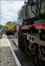 . Steam and Diesel engines photographed together on the heritage railway track Le Chemin de Fer du Bocq in the station Dorinne-Durnal on August 17th, 2013.