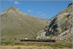 bernina-line RhB Bernina local train to Tirano has leaving the Bernina Lagalb station. 
10.09.2011