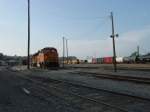 BNSF Burlington, Iowa yard during its annual carnival called 'Steamboat Days' with a ferris wheel in the background. Various BNSF diesels sit in several places. 11 June 2005.