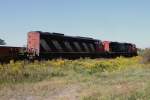 canadian-national-railway-cn CN Dash 9-44CWL 2574 and SD60F 5562 with freight train at the eastside of Toronto on 13.Sept.2010.