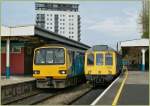 Class 121 143 604 and 121 032 in The Cardiff Queen Street Station. 
28.04.2010