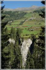engadina Where is the train? 
Ge 4/4 II 633 with the local train 1933 from Scuol Tarasp to Pontresina by Ardez. 
11.09.2011