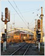 . The Sybic BB 26150 is pushing its train out of the main station of Mulhouse in the early morning of December 11th, 2013.