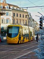 . Sola Citadis tram N 2022 is running through Rue du Sauvage in Mulhouse on December 10th, 2013.