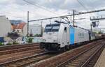 On 14 July 2022 Lineas 186 183 passes through Antwerpen-Berchem hauling a mixed freight.