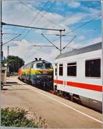The DB 218 418-2 and an othoer one in Lindau Hbf. 

analog picture / 27.07.2004