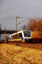 This dubble diesel multiple units from the  Nord West Bahn  company rides down the track named KBS 495 near Tilmeshof Broicherweg. It mades it's duty on the line RE10 from Kleve to the Captial of federale State NRW Dsseldorf.2011/11/26th 