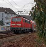 After shot: 111 080-8 on 11.12.2011 pushes the RE 9 (Rhein-Sieg-Express)  Siegen-Cologne-Aachen in the station Betzdorf/Sieg, then it goes in the direction of Cologne - Aachen.