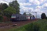 Ecco Rail 189 987 hauls a fully loaded intermodal train through Hulten on 16 August 2019.