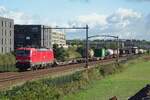 DBC 193 333 hauls a container train through Tilburg-Reeshof on 15 October 2021.