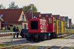 . The narrow gauge Diesel engine  Mnster  is hauling the heritage waggon N 48 on the track of the Borkumer Kleinbahn on October 8th, 2014.