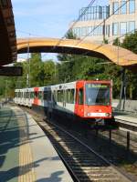 A tram (Line 18 to Buchheim) is leaving the station  Zoo/Flora .

Cologne on August 21st 2013.