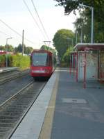 A tram (Line 18 to Buchheim) is leaving the station  Efferen . Cologne on August 21st 2013.