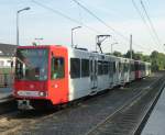 A tram (Line 18 to Bonn main station) is standing in the station  Efferen . Cologne on August 21st 2013.