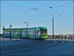 A tram is leaving the Augustusbrcke in Dresden and is entering into Sophienstrae on December 28th, 2012.